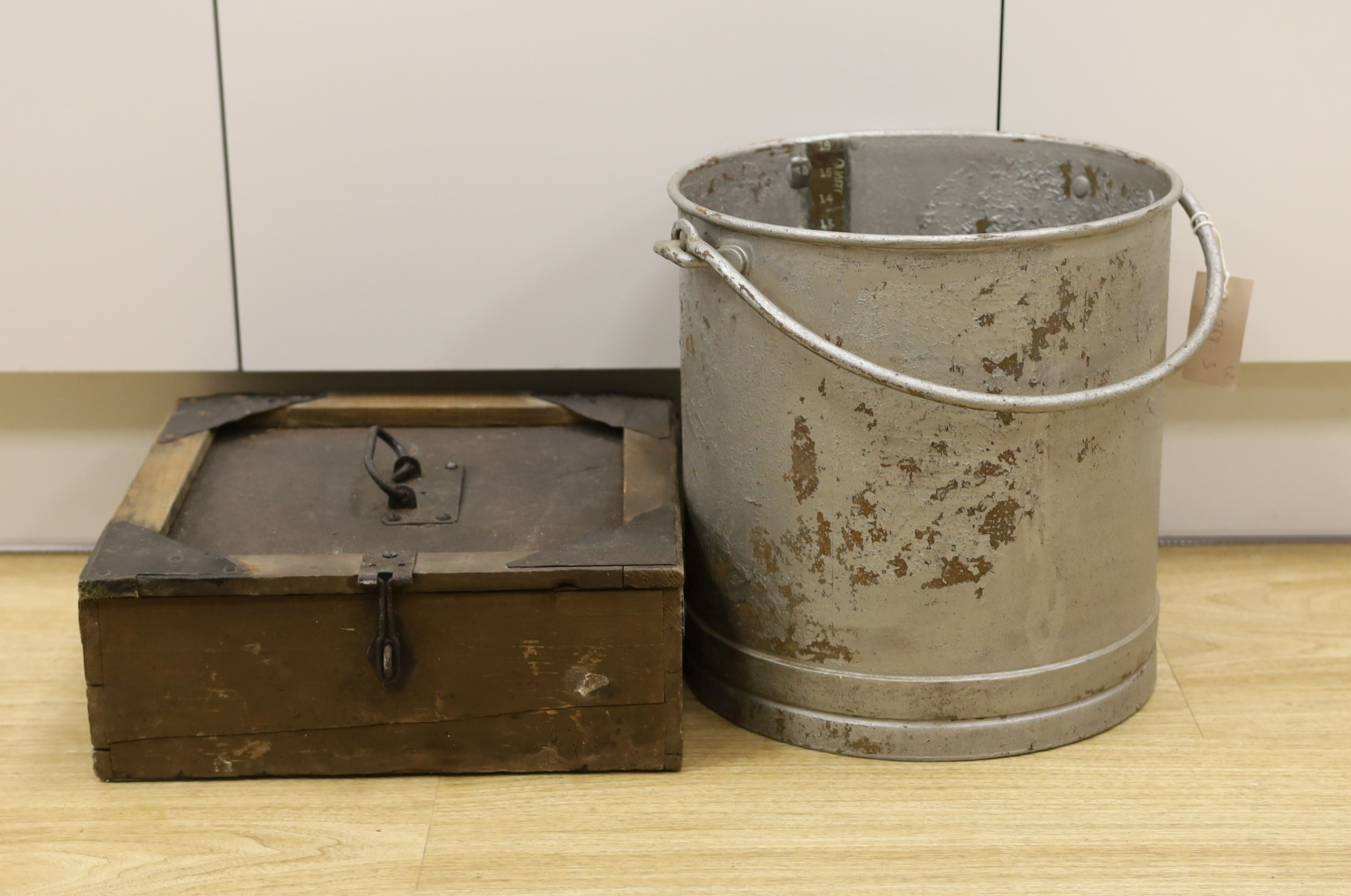 A brass mounted galvanised four gallon bucket and a case of milk sample bottles, Galvanised bucket 31 cms high.